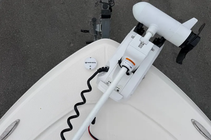 Slide: The Image of The image shows the bow of a Robalo 206 Cayman boat with a mounted electric motor. - 35