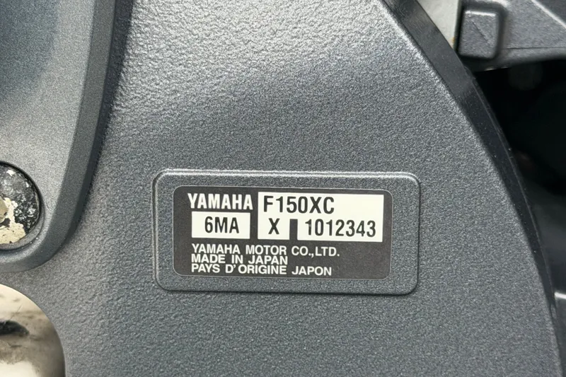 Slide: The Image of Yamaha F150XC engine label on 2024 Robalo 206 Cayman boat, made in Japan. - 65
