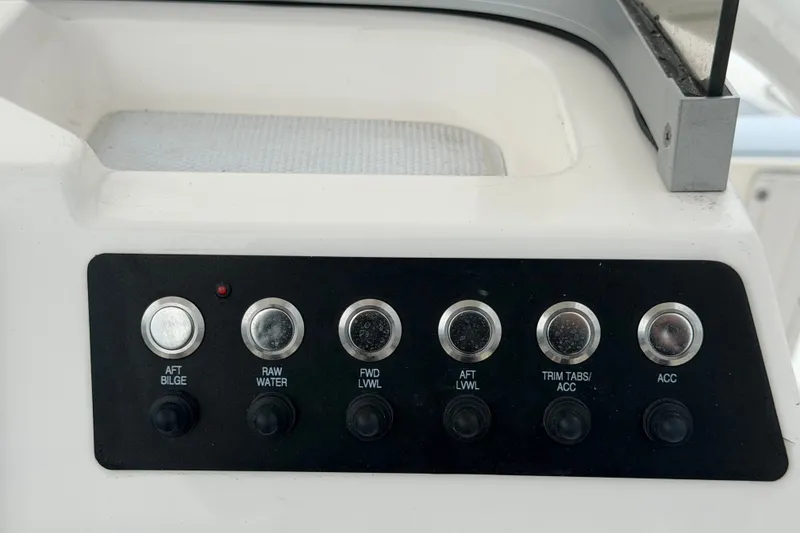 Slide: The Image of Control panel of 2024 Robalo 206 Cayman boat with labeled switches. - 21