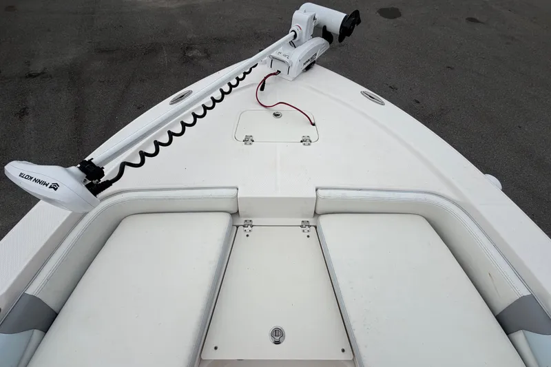 Slide: The Image of The image shows the bow deck of a 2024 Robalo 206 Cayman with a Minn Kota trolling motor. - 25