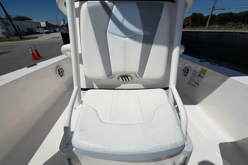 Slide: The Image of 2024 Robalo 206 Cayman boat seat with white upholstery and sleek design. - 28