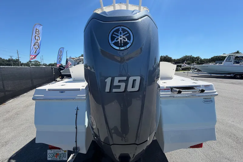 Slide: The Image of 2024 Robalo 206 Cayman boat with Yamaha 150 engine, displayed outdoors. - 3