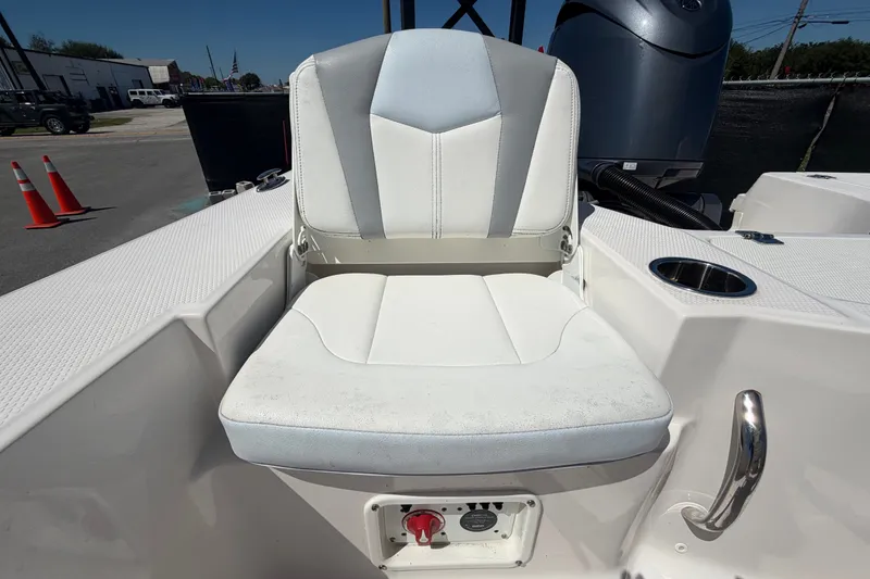 Slide: The Image of 2024 Robalo 206 Cayman boat seat with cup holder and control panel. - 32