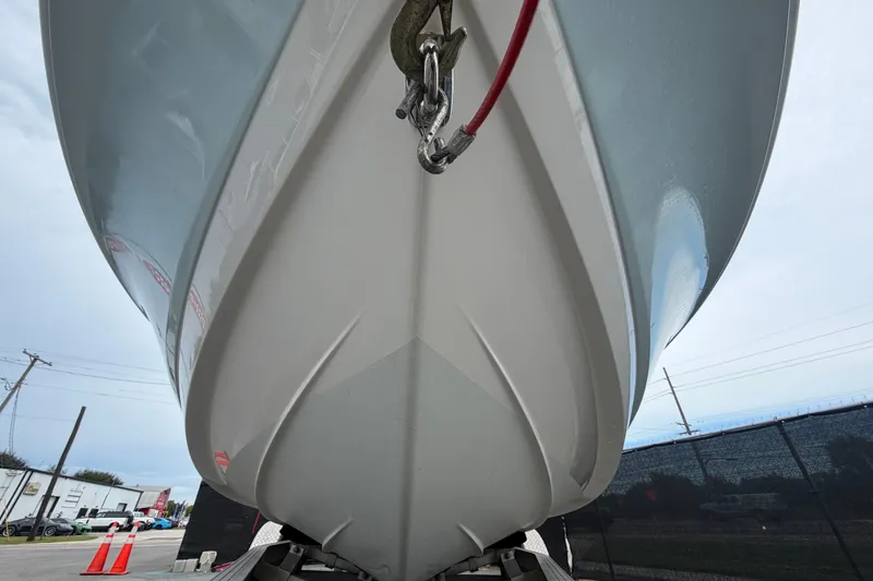Slide: The Image of 2024 Robalo 206 Cayman boat hull, close-up view from below, showcasing sleek design. - 10
