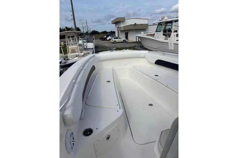 Slide: The Image of 2013 Wellcraft 30 Scarab Sport boat interior, featuring spacious seating and sleek design. - 14