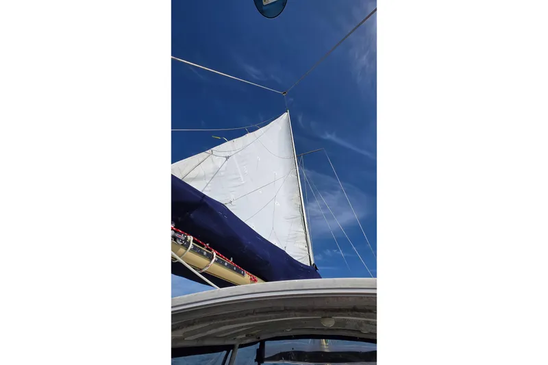 Slide: The Image of Sailing on a 1977 Camper & Nicholsons 42 Ketch under clear blue skies. - 3