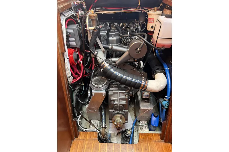 Slide: The Image of Engine compartment of a 1981 Nordic Boats 40, showcasing detailed mechanical components. - 53