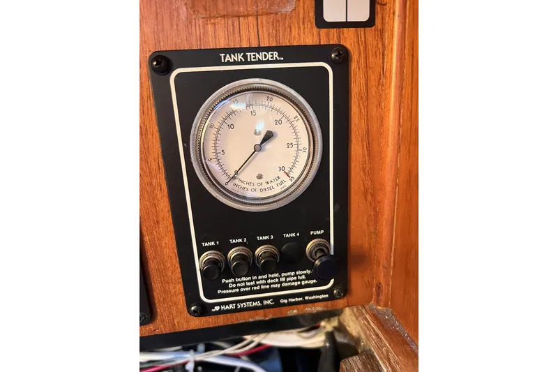 Slide: The Image of Tank tender gauge on 1981 Nordic Boats 40, displaying water and diesel levels. - 63