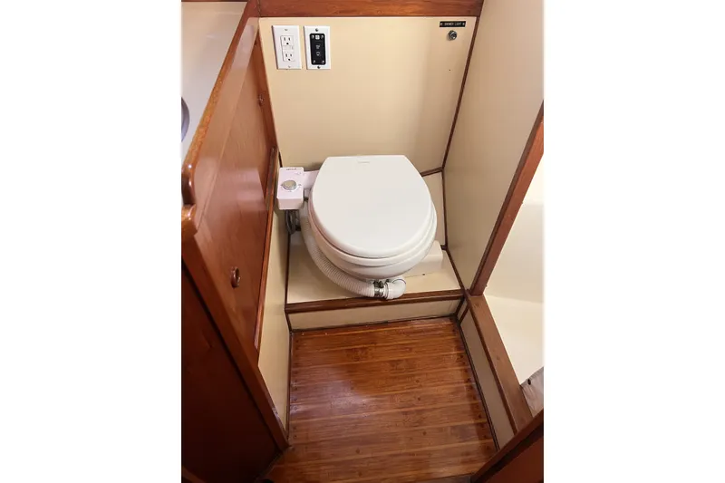 Slide: The Image of 1981 Nordic Boats 40 bathroom with wooden flooring and compact toilet. - 38