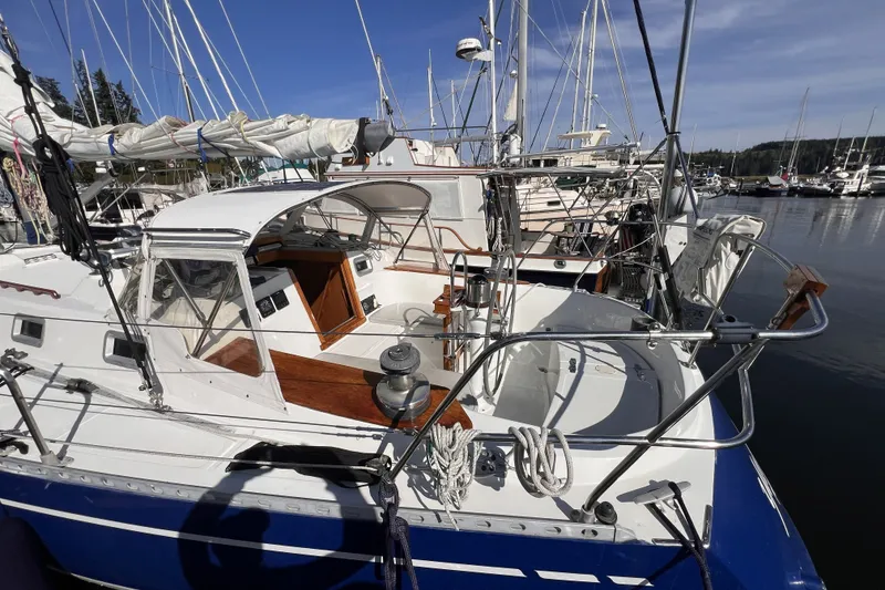 Slide: The Image of 1981 Nordic Boats 40 sailboat docked in marina, featuring sleek design and spacious cockpit. - 7