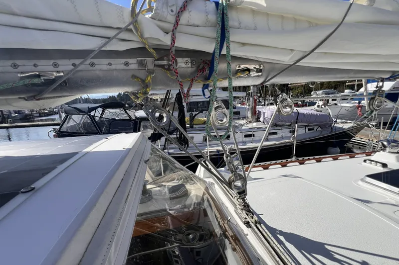 Slide: The Image of 1981 Nordic Boats 40 sailboat docked, showcasing rigging and marina setting. - 16