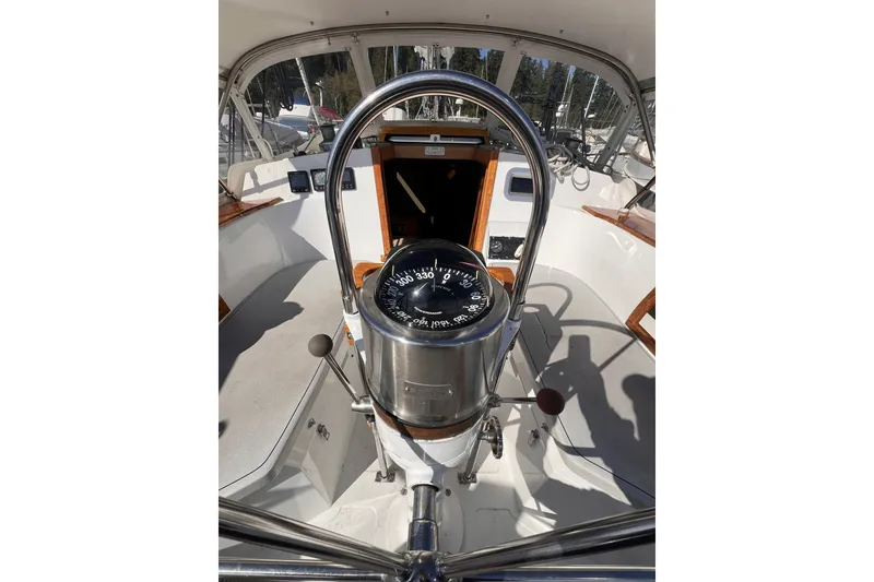 Slide: The Image of Cockpit view of 1981 Nordic Boats 40, featuring compass and steering wheel. - 27
