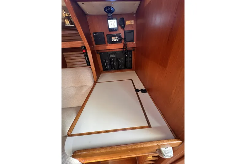 Slide: The Image of Interior of 1981 Nordic Boats 40, featuring navigation equipment and wooden cabinetry. - 49