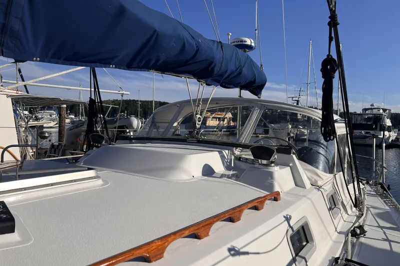 Slide: The Image of 1981 Nordic Boats 40 sailboat docked at marina under clear blue sky. - 17