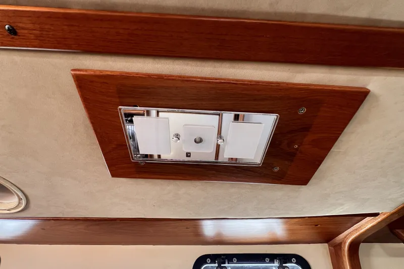 Slide: The Image of Ceiling light fixture on 1981 Nordic Boats 40, featuring wood paneling and modern design. - 51
