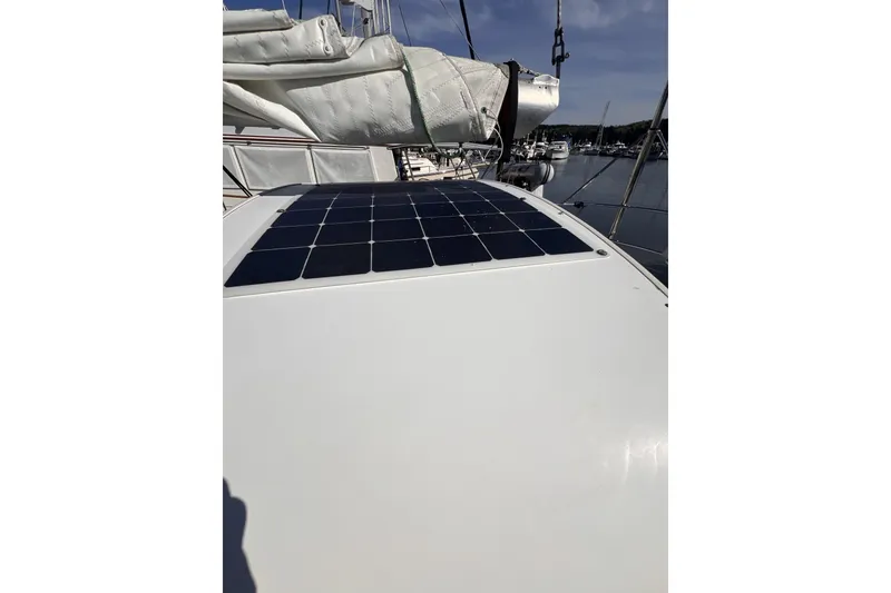 Slide: The Image of 1981 Nordic Boats 40 with solar panel on deck, docked in marina. - 23