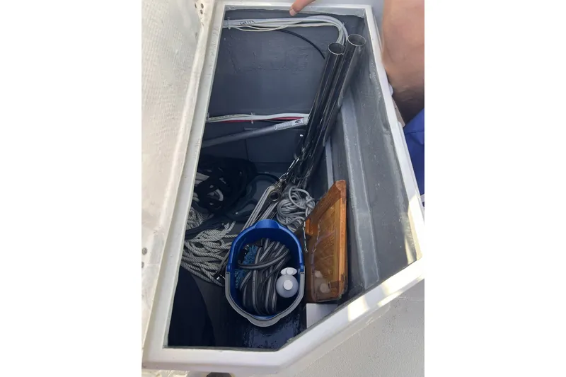 Slide: The Image of Storage compartment of a 1981 Nordic Boats 40, containing ropes and equipment. - 31