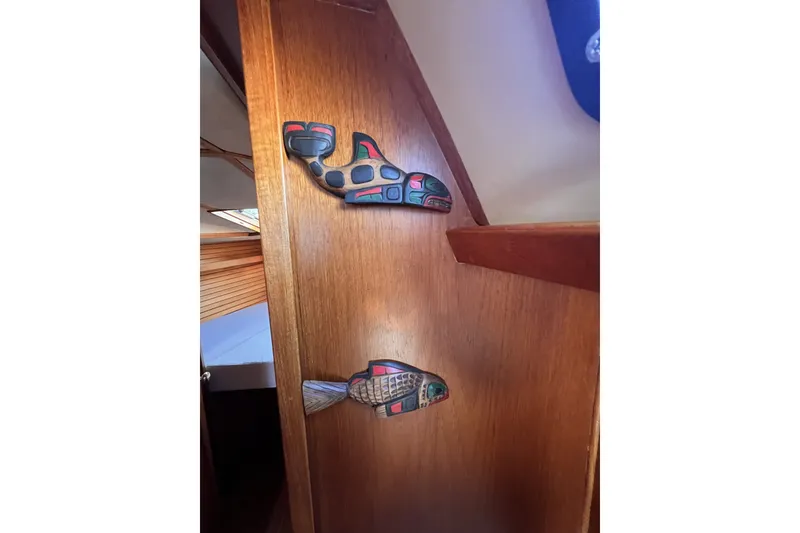 Slide: The Image of Wooden interior of 1981 Nordic Boats 40 with decorative wall art. - 36