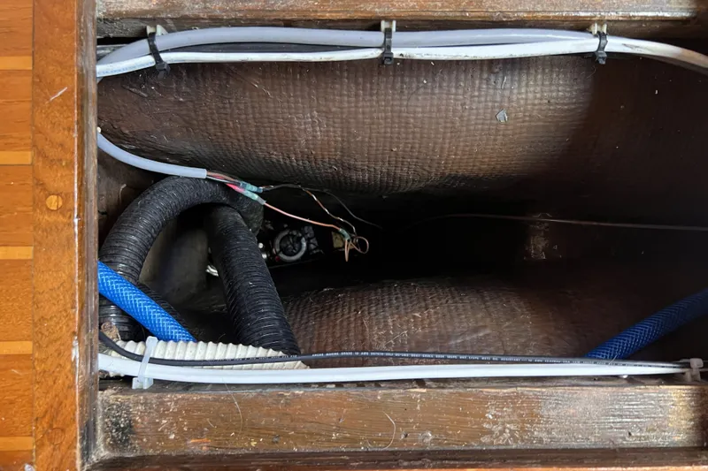 Slide: The Image of Interior view of 1981 Nordic Boats 40 showing wiring and hoses. - 60