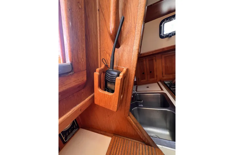 Slide: The Image of Wooden interior of 1981 Nordic Boats 40 with radio holder and kitchen sink. - 44