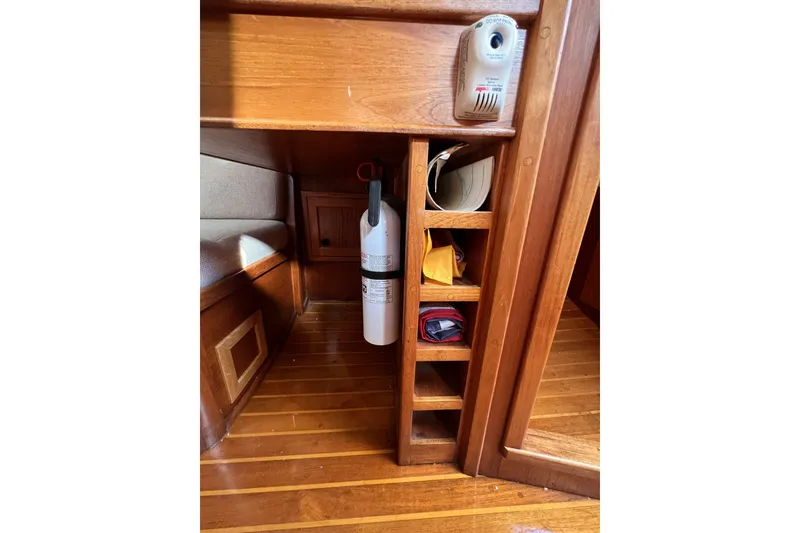 Slide: The Image of 1981 Nordic Boats 40 interior with wooden shelves and fire extinguisher. - 43