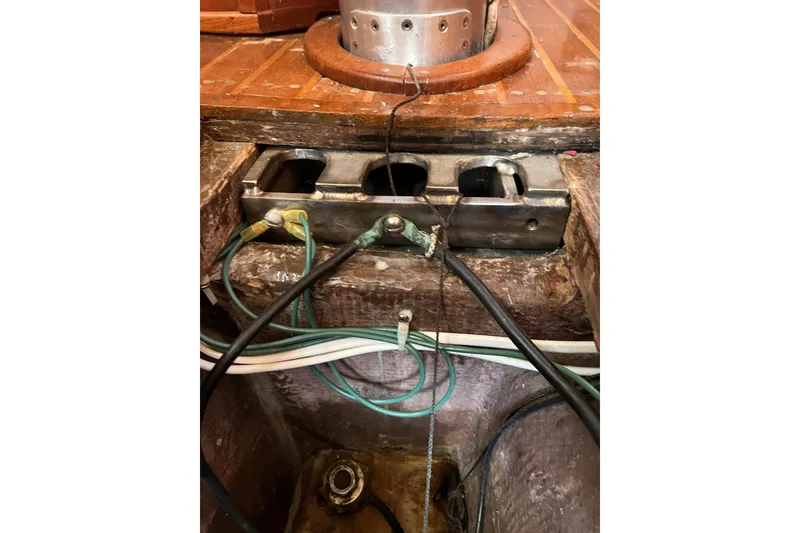 Slide: The Image of Interior view of a 1981 Nordic Boats 40, showing wiring and metal components. - 62