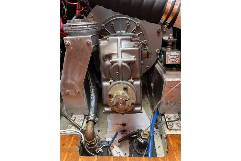 Slide: The Image of Engine compartment of a 1981 Nordic Boats 40, showcasing mechanical components and wiring. - 55
