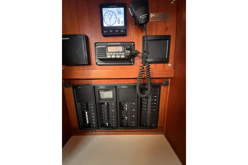 Slide: The Image of Control panel of a 1981 Nordic Boats 40, featuring navigation and communication equipment. - 42