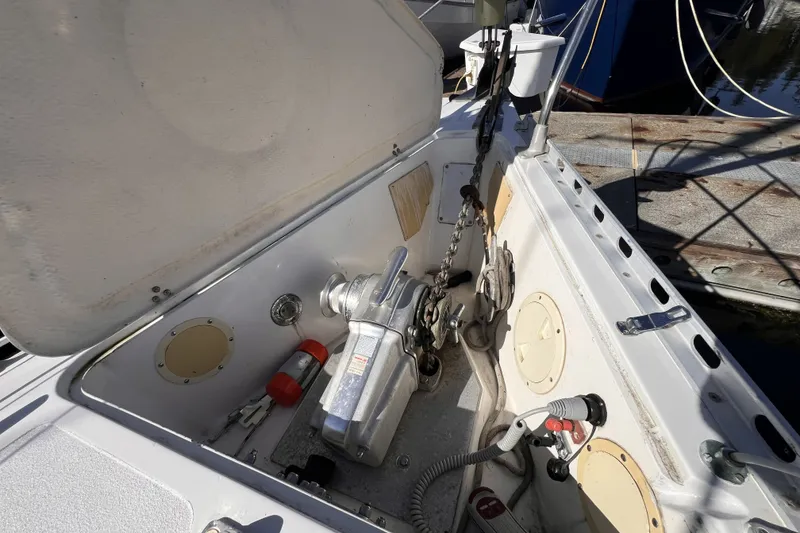 Slide: The Image of Anchor compartment of a 1981 Nordic Boats 40, featuring winch and chain. - 14