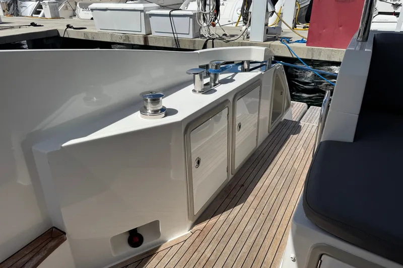 Slide: The Image of 2018 Azimut 66 yacht deck with storage compartments and mooring cleats. - 13