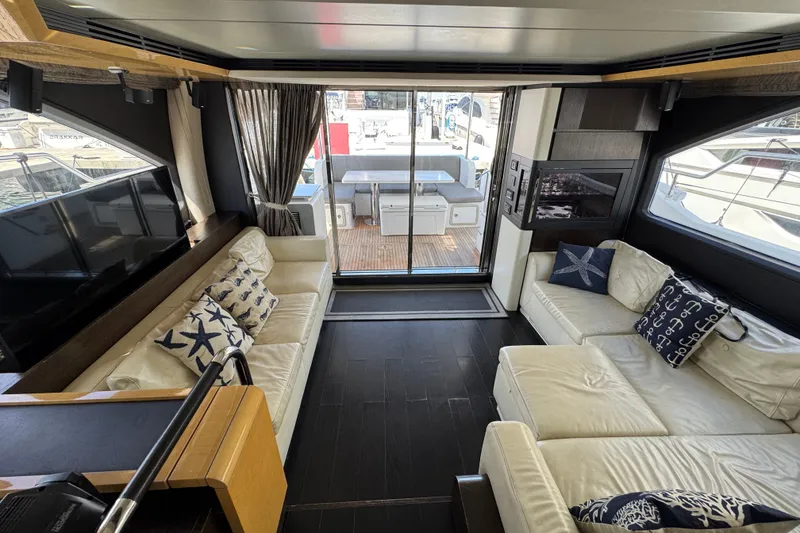 Slide: The Image of Luxurious interior of 2018 Azimut 66 yacht with elegant seating and nautical decor. - 15