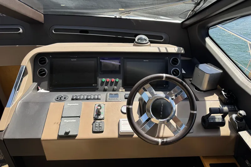 Slide: The Image of Cockpit of 2018 Azimut 66 yacht with steering wheel and navigation controls. - 17