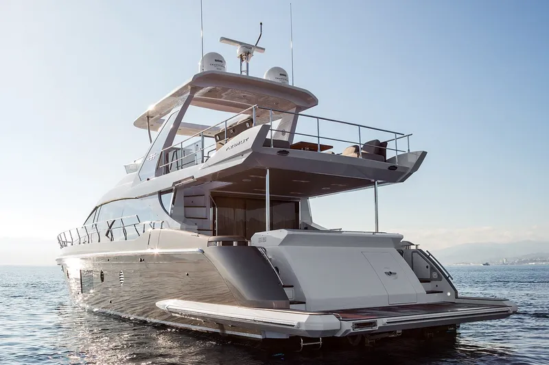 Slide: The Image of Luxurious 2018 Azimut 66 yacht on serene ocean waters, showcasing sleek design and elegance. - 5