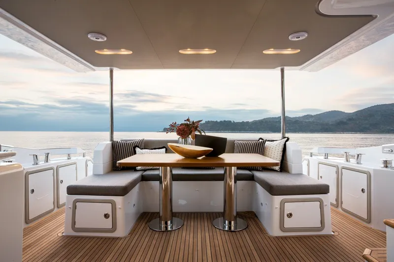 Slide: The Image of Luxurious 2018 Azimut 66 yacht deck with elegant seating and scenic ocean view. - 8