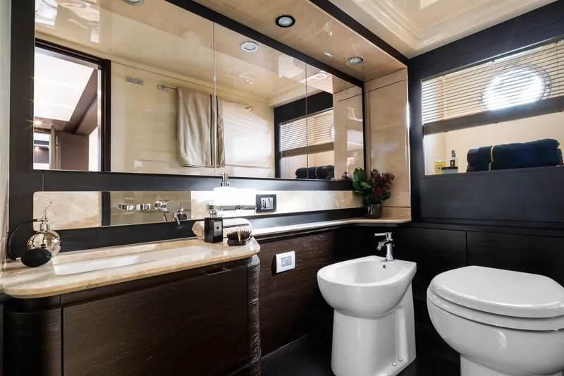 Slide: The Image of Luxurious bathroom interior on a 2018 Azimut 66 yacht, featuring elegant fixtures and modern design. - 12
