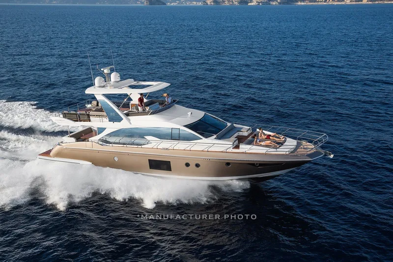 Slide: The Image of 2018 Azimut 66 yacht cruising on open sea with passengers relaxing on deck. - 1