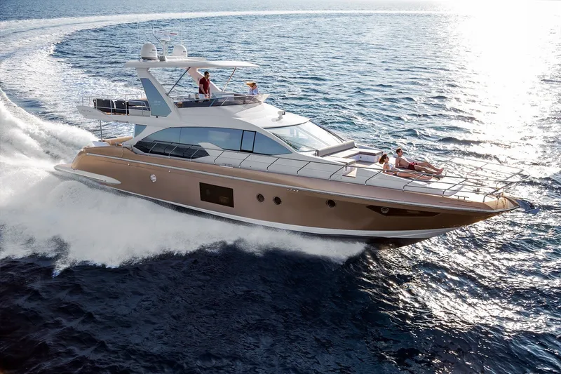 Slide: The Image of Luxurious 2018 Azimut 66 yacht cruising on open sea with passengers enjoying the sun. - 3