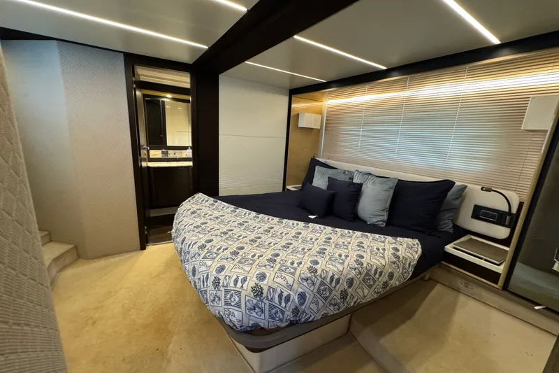 Slide: The Image of Luxurious bedroom interior of 2018 Azimut 66 yacht with modern design and cozy bedding. - 18