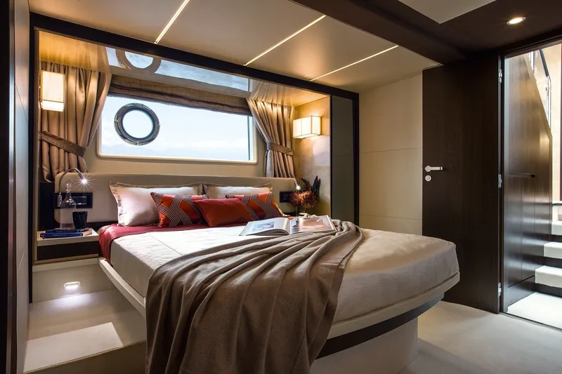 Slide: The Image of Luxurious bedroom interior of 2018 Azimut 66 yacht with elegant decor and cozy bedding. - 10