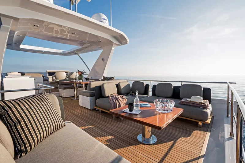 Slide: The Image of Luxurious 2018 Azimut 66 yacht deck with elegant seating and ocean view. - 7