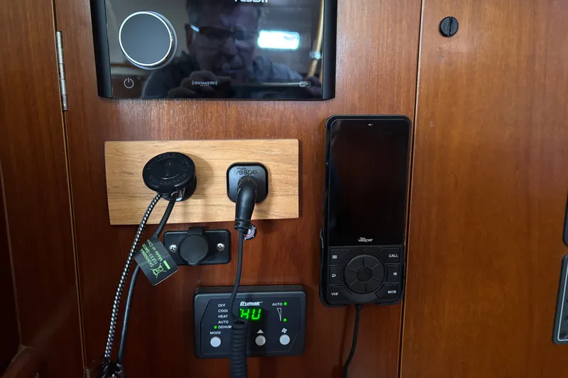 Slide: The Image of Control panel and electronics on a 1999 Beneteau 381 sailboat interior. - 12