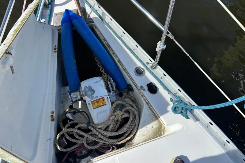 Slide: The Image of Anchor locker on a 1999 Beneteau 381 sailboat with ropes and equipment. - 4