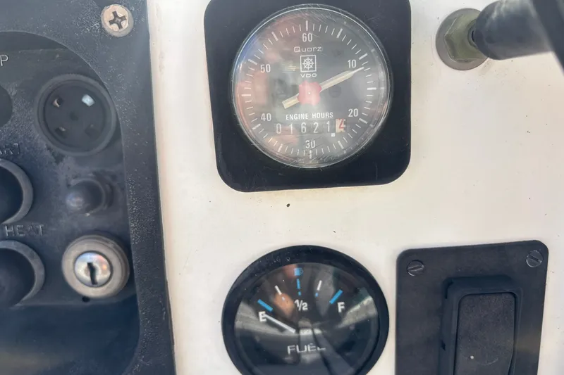 Slide: The Image of Close-up of Beneteau 381's engine hours and fuel gauges, 1999 model. - 6