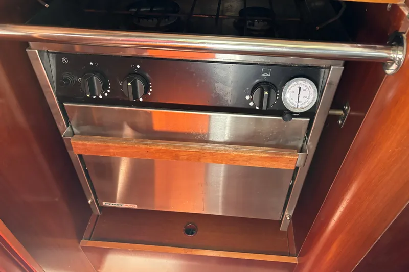 Slide: The Image of Stainless steel oven with wooden handle on 1999 Beneteau 381 yacht. - 15