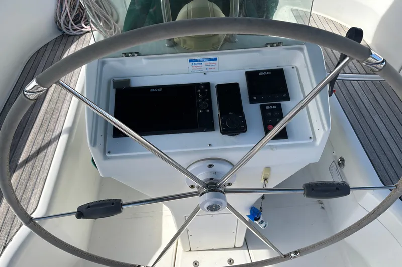 Slide: The Image of Steering wheel and navigation instruments on a 1999 Beneteau 381 sailboat. - 8