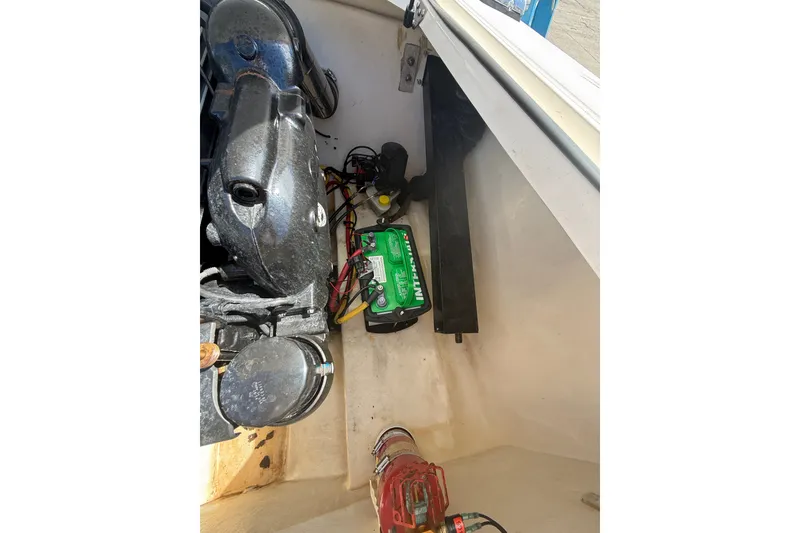 Slide: The Image of Engine compartment of a 2018 Donzi 22 Classic boat, featuring battery and components. - 16