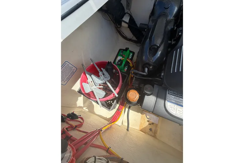 Slide: The Image of Engine compartment of a 2018 Donzi 22 Classic boat with visible components. - 14
