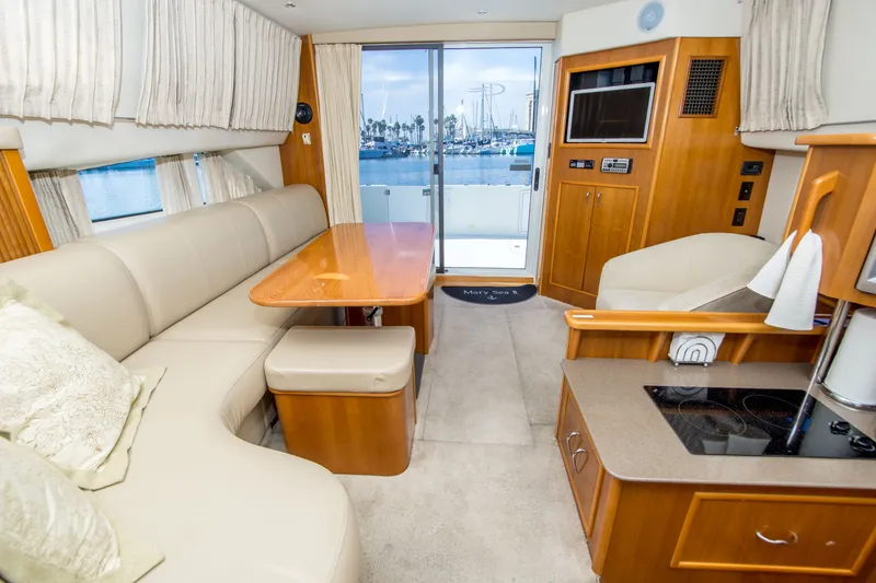 Slide: The Image of Luxurious interior of 2006 Carver 33 Super Sport yacht with elegant seating and modern amenities. - 22