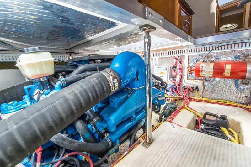 Slide: The Image of Engine room of 2006 Carver 33 Super Sport with visible components and wiring. - 32