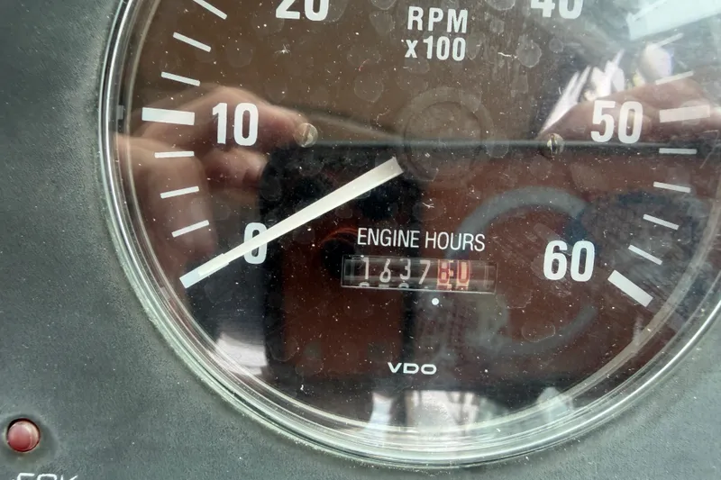 Slide: The Image of Close-up of a Tiara Yachts 2900 Coronet 2001 engine hour meter showing 1637 hours. - 24